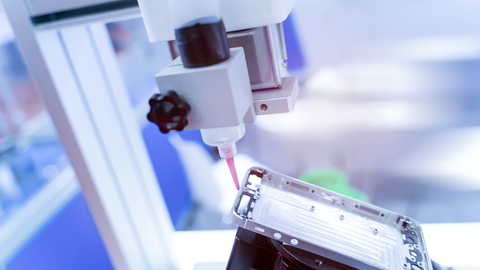automatic dispensing system applies adhesive to a cell phone frame automatic dispensing system applies adhesive to a cell phone frame